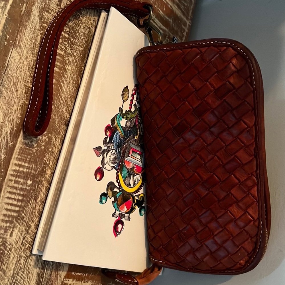Wrist wallet in burned orange Italian leather
